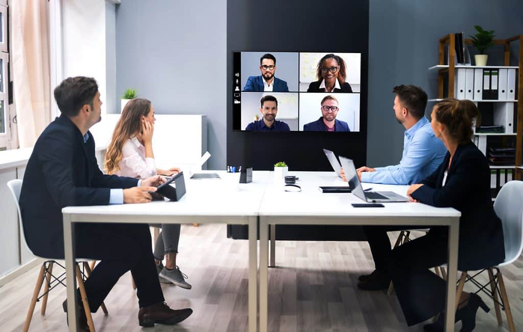 business people in conference room using video conferencing