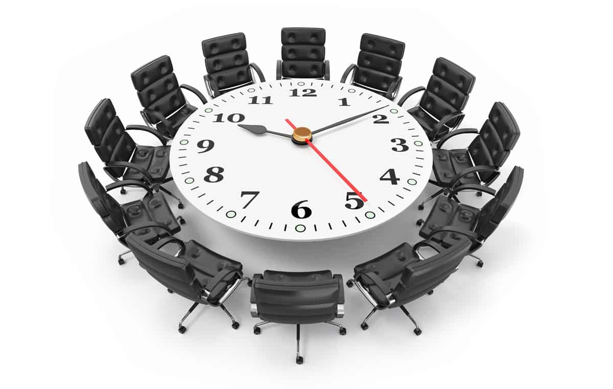 meeting room table with a clock